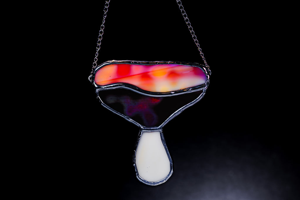 Stained glass with a colorful design on a black background