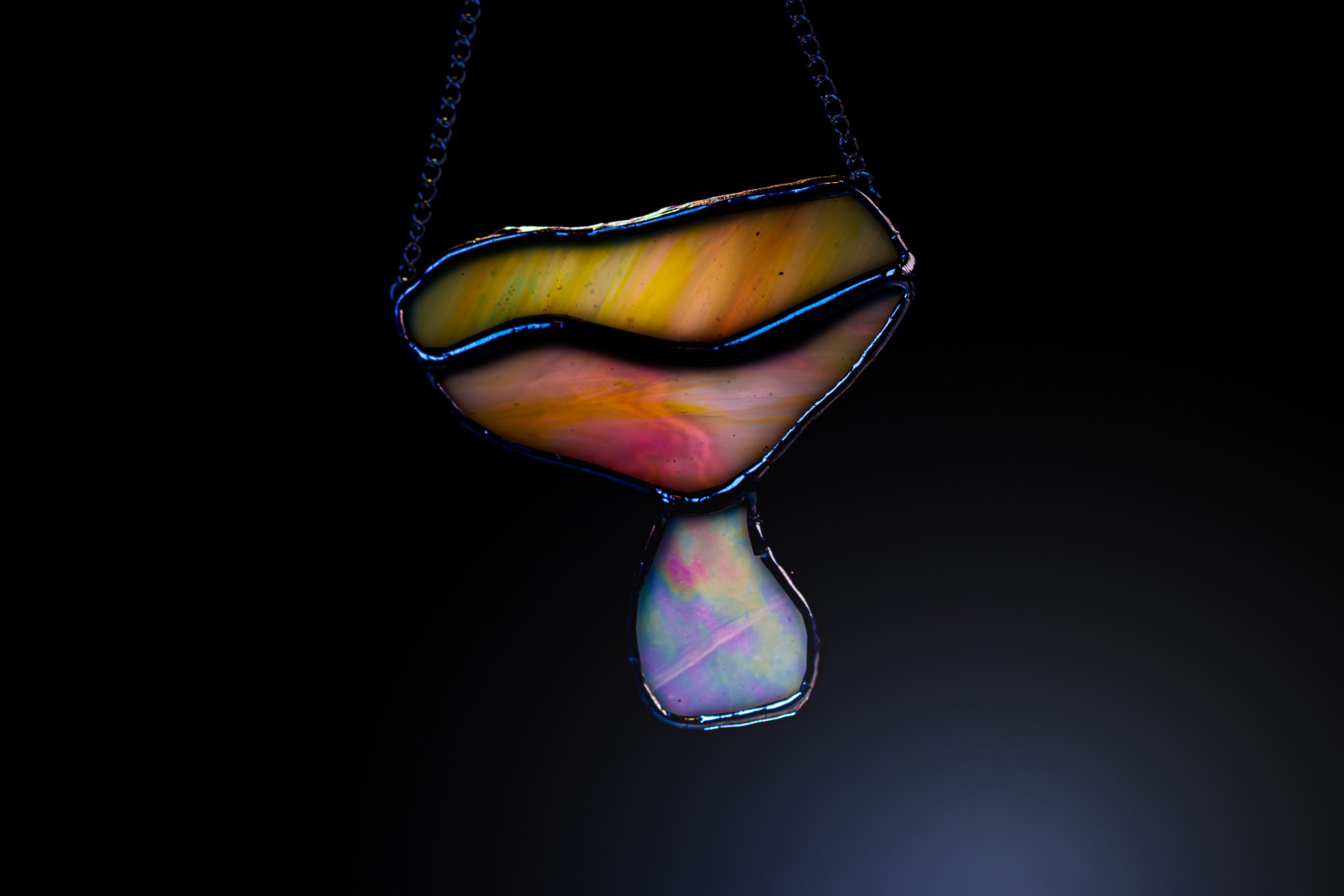 Colorful mushroom stained glass on a dark background